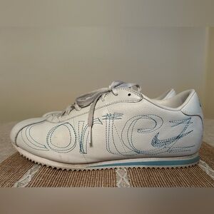 Nike Cortez - Women’s Size US 11. Lightly Used Condition. White/Blue Embroidery.